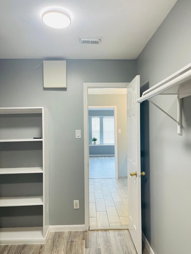5530 Imperial Grove Dr, Houston, TX 77066 - hallway with wood finished floors and baseboards