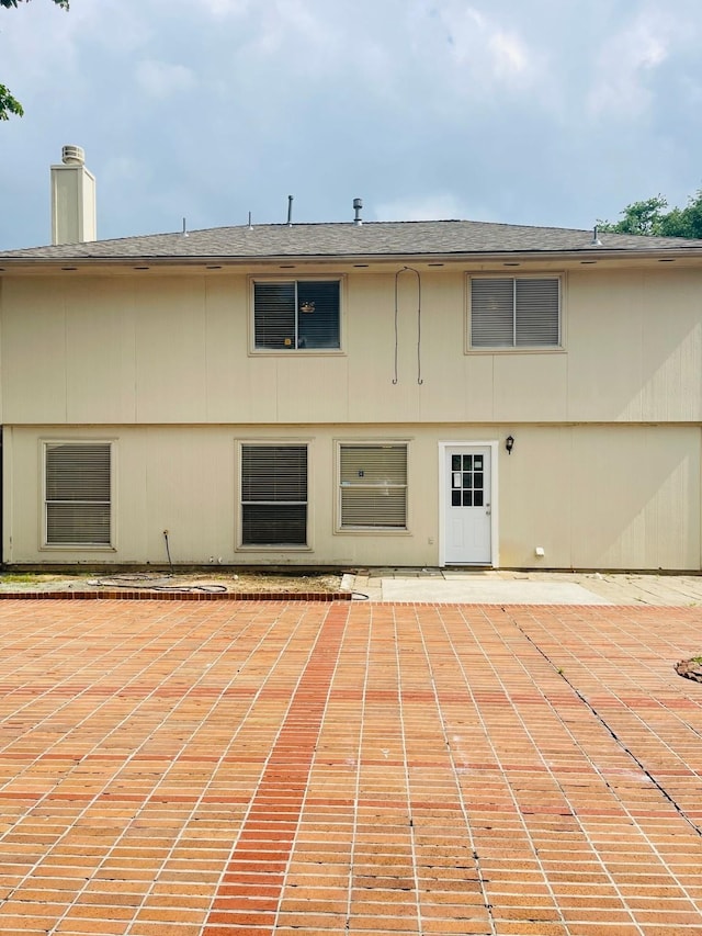 5530 Imperial Grove Dr, Houston, TX 77066 - rear view of property featuring a patio and a chimney