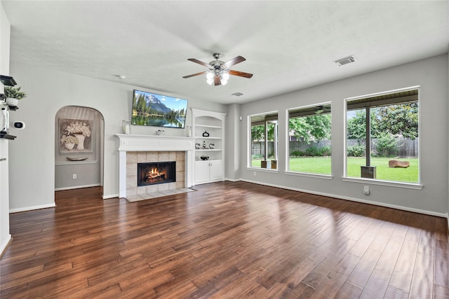17518 Cypress Laurel St, Houston, TX 77095 - unfurnished living room with ceiling fan, baseboards, a tile fireplace, and wood finished floors