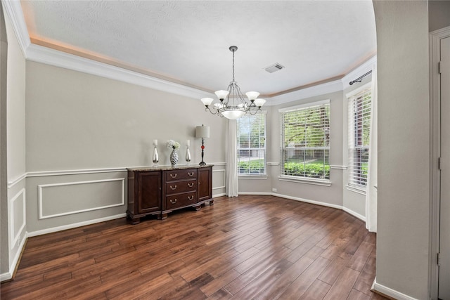 17518 Cypress Laurel St, Houston, TX 77095 - dining area with a chandelier, dark wood-type flooring, ornamental molding, and baseboards