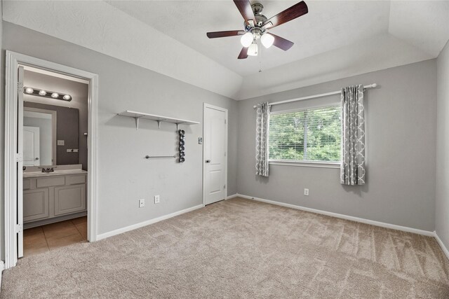 17518 Cypress Laurel St, Houston, TX 77095 - unfurnished bedroom with light colored carpet, baseboards, ensuite bathroom, a sink, and lofted ceiling