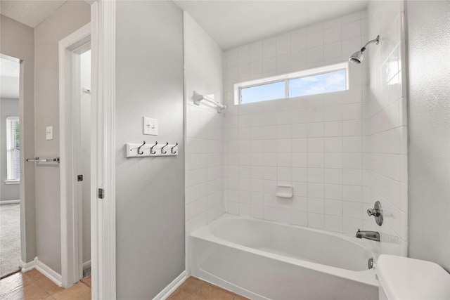 17518 Cypress Laurel St, Houston, TX 77095 - bathroom featuring tile patterned flooring, washtub / shower combination, and baseboards