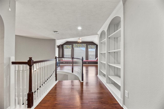 17518 Cypress Laurel St, Houston, TX 77095 - hallway with an upstairs landing, wood finished floors, a textured ceiling, lofted ceiling, and built in features