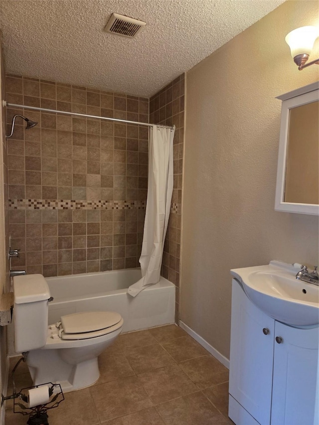 12029 Greenwood Forest Dr, Houston, TX 77066 - full bath featuring shower / tub combo, a textured ceiling, tile patterned flooring, toilet, and vanity
