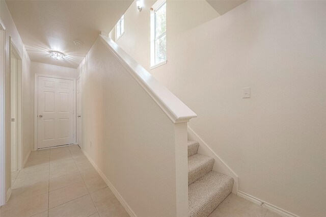 1119 Palmer St, Houston, TX 77003 - stairway featuring tile patterned flooring and baseboards