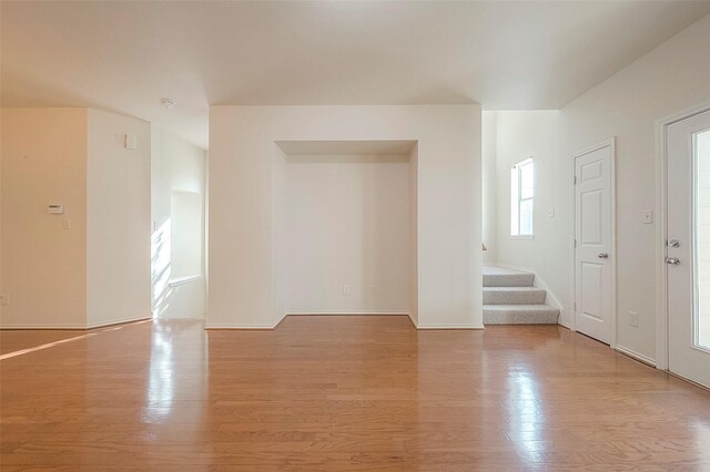 1119 Palmer St, Houston, TX 77003 - unfurnished room with light wood-type flooring, stairs, and baseboards