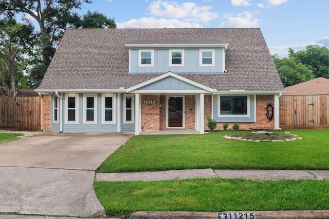 11215 Sageway Dr, Houston, TX 77089 - view of front of property with brick siding, driveway, a shingled roof, a gate, and a porch