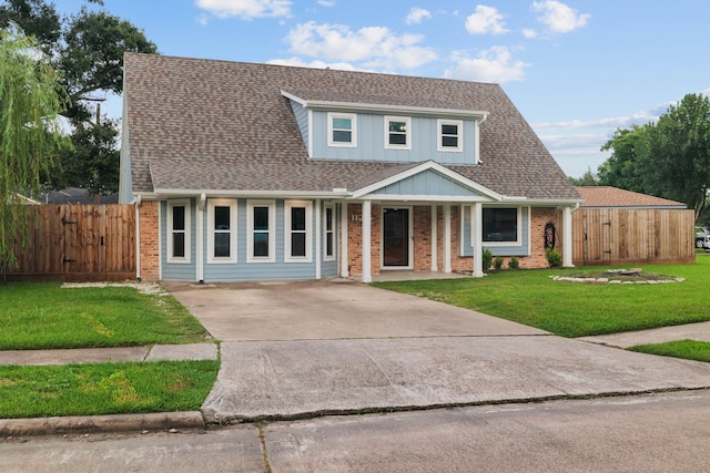 11215 Sageway Dr, Houston, TX 77089 - traditional-style house featuring brick siding, concrete driveway, roof with shingles, a porch, and a gate