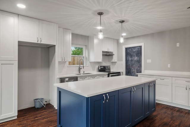11215 Sageway Dr, Houston, TX 77089 - kitchen featuring appliances with stainless steel finishes, under cabinet range hood, blue cabinets, white cabinets, and recessed lighting