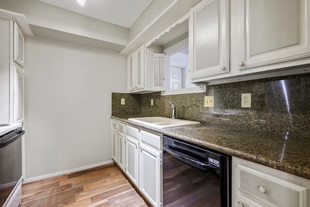 1311 Antoine Dr Unit 111, Houston, TX 77055 - kitchen with black dishwasher, a sink, decorative backsplash, light wood-style floors, and range