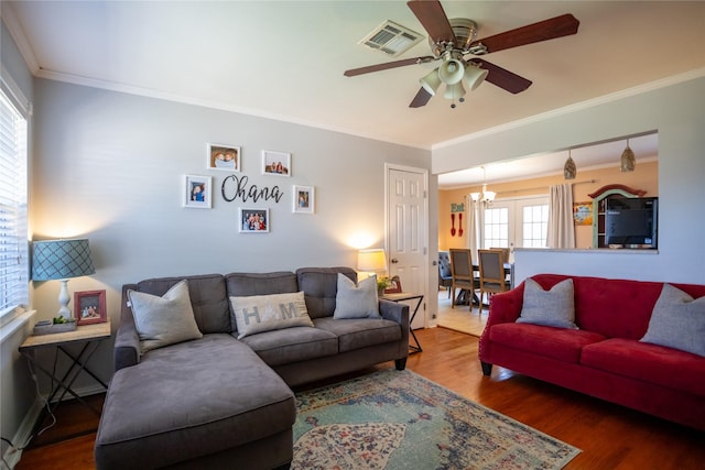 1803 Foxwood Rd, Houston, TX 77008 - living room with a ceiling fan, a chandelier, wood finished floors, and crown molding