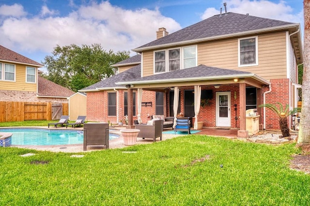 1114 Carriage Ct, Seabrook, TX 77586 - back of house featuring an outdoor living space, a chimney, brick siding, roof with shingles, and a patio