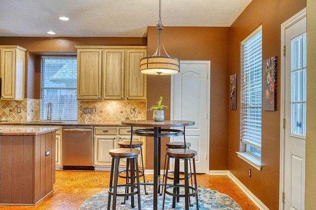 1114 Carriage Ct, Seabrook, TX 77586 - kitchen featuring dishwasher, healthy amount of natural light, backsplash, a textured ceiling, and recessed lighting
