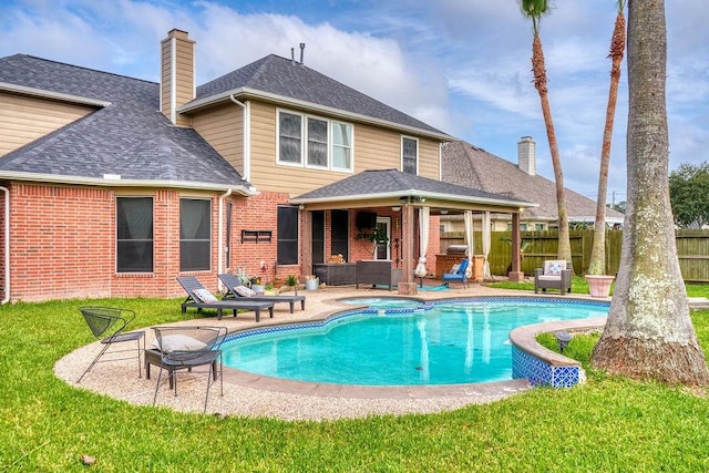 1114 Carriage Ct, Seabrook, TX 77586 - rear view of house with a chimney, brick siding, a patio, and roof with shingles