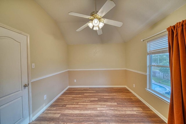 1114 Carriage Ct, Seabrook, TX 77586 - empty room featuring lofted ceiling, wood finished floors, ceiling fan, and baseboards