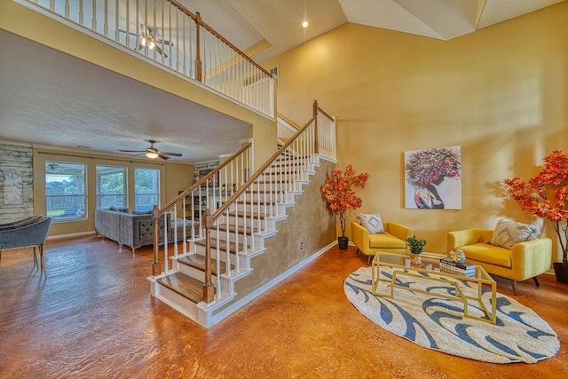 1114 Carriage Ct, Seabrook, TX 77586 - staircase with ceiling fan, baseboards, and a high ceiling