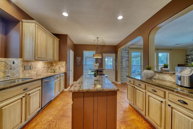 1114 Carriage Ct, Seabrook, TX 77586 - kitchen featuring dishwasher, a sink, light brown cabinets, decorative backsplash, and a textured ceiling