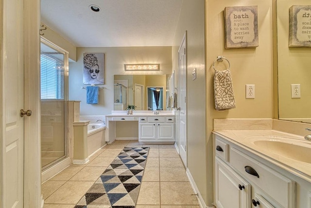 1114 Carriage Ct, Seabrook, TX 77586 - bathroom with two vanities, tile patterned flooring, a stall shower, and a bath