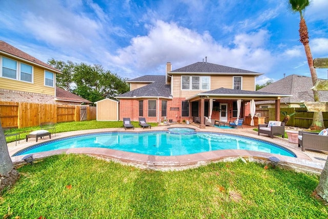 1114 Carriage Ct, Seabrook, TX 77586 - view of swimming pool with outdoor lounge area, a patio, and a pool with connected hot tub