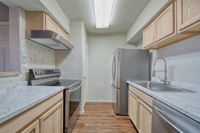 6001 Reims Rd Unit 1207, Houston, TX 77036 - kitchen featuring stainless steel appliances, light brown cabinets, and a sink