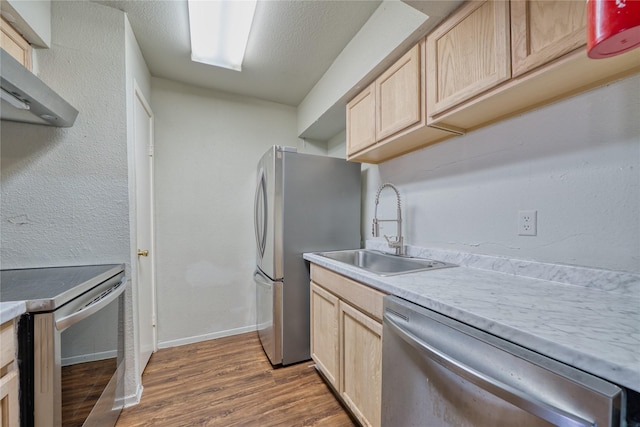 6001 Reims Rd Unit 1207, Houston, TX 77036 - kitchen with appliances with stainless steel finishes, light brown cabinets, a sink, and dark wood-style floors