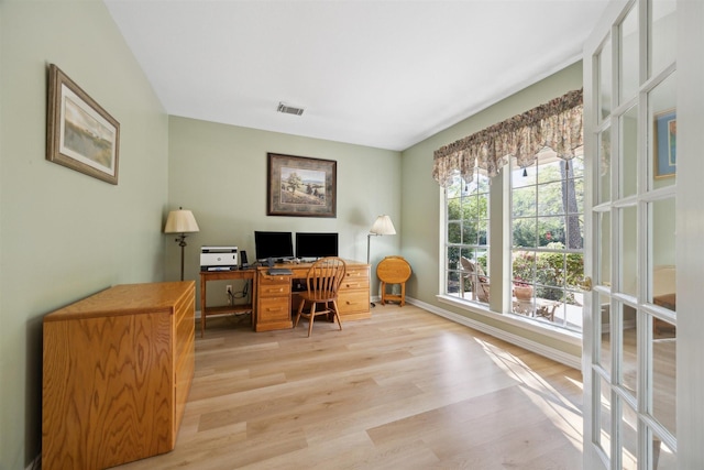 2 Slatestone Cir, The Woodlands, TX 77382 - home office with light wood-style flooring and baseboards