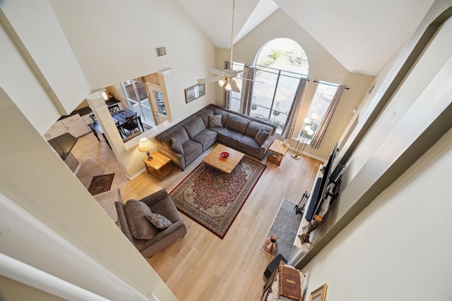 2 Slatestone Cir, The Woodlands, TX 77382 - living room with high vaulted ceiling, a ceiling fan, and wood finished floors