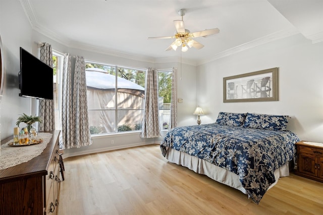 2 Slatestone Cir, The Woodlands, TX 77382 - bedroom with wood finished floors, ornamental molding, a ceiling fan, and baseboards