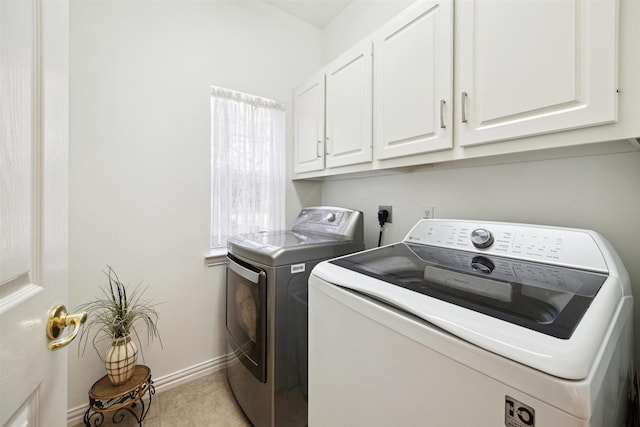 2 Slatestone Cir, The Woodlands, TX 77382 - laundry area featuring cabinet space, independent washer and dryer, baseboards, and light tile patterned flooring