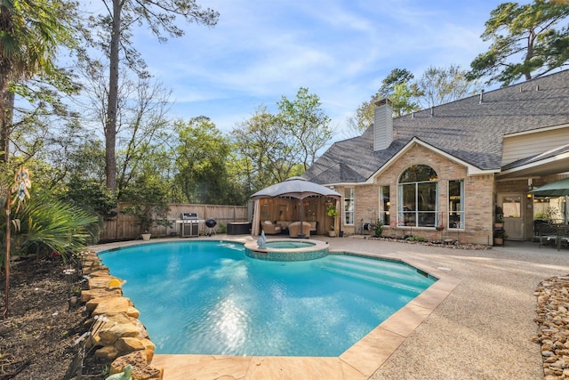 2 Slatestone Cir, The Woodlands, TX 77382 - view of swimming pool featuring a patio area, a fenced backyard, a grill, a pool with connected hot tub, and a gazebo