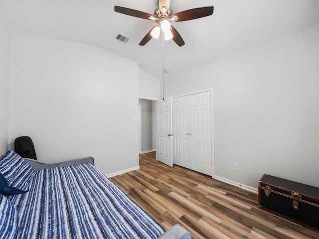 21023 Kirkland Woods Dr, Houston, TX 77095 - unfurnished bedroom featuring lofted ceiling, wood finished floors, baseboards, a closet, and a ceiling fan