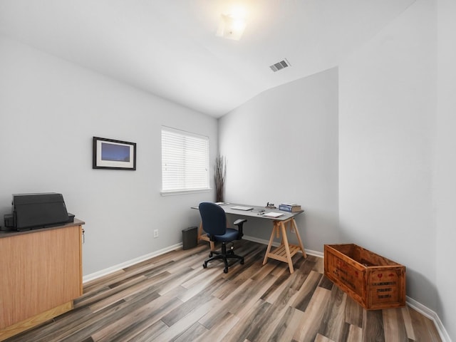 21023 Kirkland Woods Dr, Houston, TX 77095 - office area featuring wood finished floors, vaulted ceiling, and baseboards