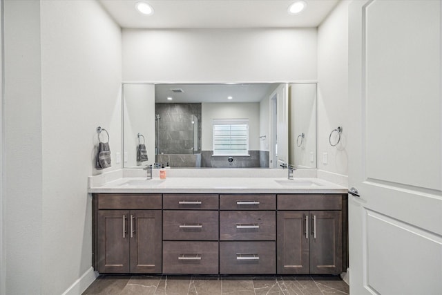 1808 Northwood St Unit A, Houston, TX 77009 - full bath featuring a stall shower, double vanity, marble finish floors, and recessed lighting