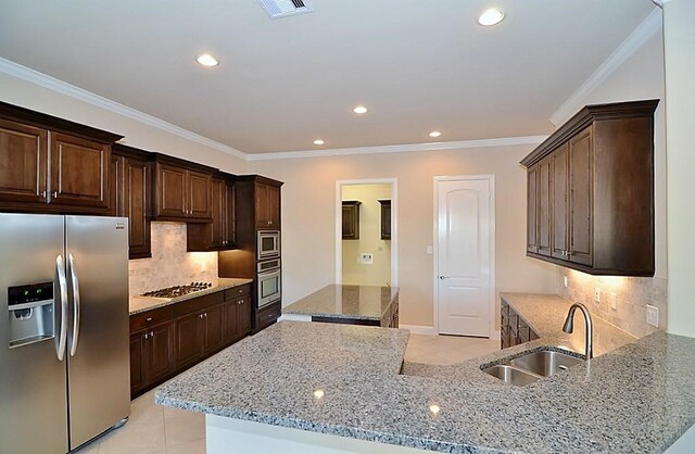 4435 Calvet Forest Dr, Katy, TX 77494 - kitchen with stainless steel appliances, a sink, light tile patterned floors, light stone counters, and recessed lighting
