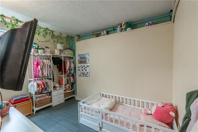 6443 Hardy Weedon Rd, College Station, TX 77845 - bedroom featuring wood finished floors and a closet