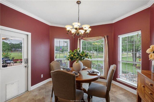 6443 Hardy Weedon Rd, College Station, TX 77845 - dining space featuring a chandelier, crown molding, light tile patterned floors, and baseboards