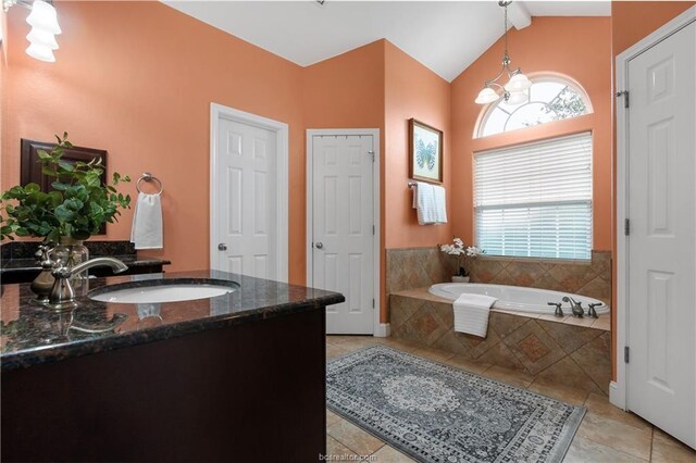 6443 Hardy Weedon Rd, College Station, TX 77845 - full bath with a chandelier, tile patterned flooring, a garden tub, lofted ceiling, and vanity