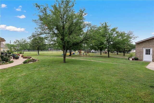 6443 Hardy Weedon Rd, College Station, TX 77845 - view of yard featuring a playground