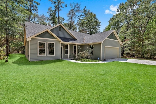 247 Mistletoe, Onalaska, TX 77360 - view of front of home featuring concrete driveway, a garage, roof with shingles, and a front lawn