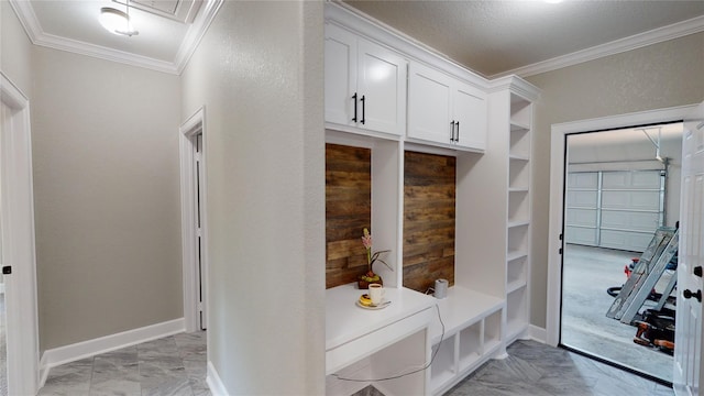 247 Mistletoe, Onalaska, TX 77360 - mudroom featuring ornamental molding, light marble finish flooring, and baseboards