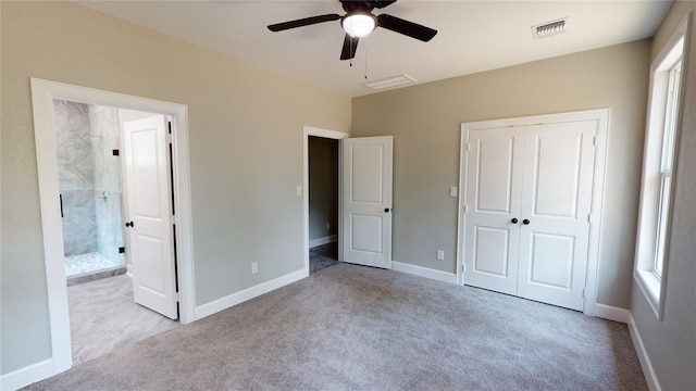 247 Mistletoe, Onalaska, TX 77360 - unfurnished bedroom featuring carpet flooring, a closet, connected bathroom, ceiling fan, and baseboards