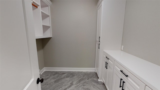 247 Mistletoe, Onalaska, TX 77360 - laundry room with light marble finish flooring and baseboards