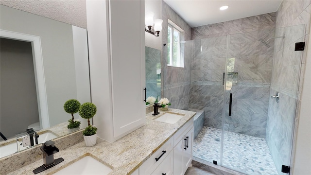 247 Mistletoe, Onalaska, TX 77360 - full bathroom with a shower stall, double vanity, and recessed lighting