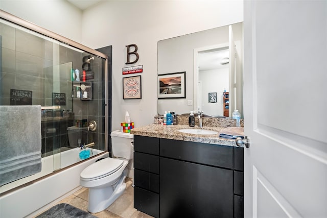 11434 Ketch Ct, Willis, TX 77318 - bathroom featuring toilet, enclosed tub / shower combo, vanity, and tile patterned floors