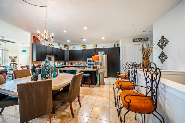 11434 Ketch Ct, Willis, TX 77318 - dining room with light tile patterned floors, recessed lighting, and a chandelier