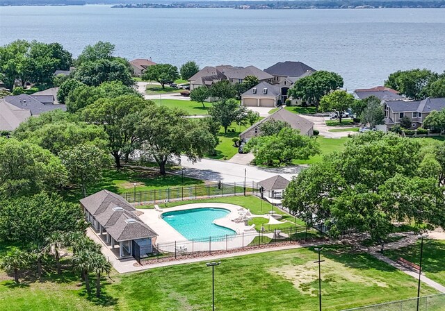 11434 Ketch Ct, Willis, TX 77318 - aerial perspective of suburban area with a pool area and a nearby body of water