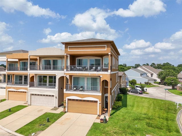 11434 Ketch Ct, Willis, TX 77318 - view of front of house with stucco siding, a garage, driveway, and a front lawn