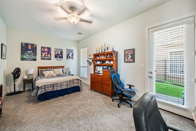 11434 Ketch Ct, Willis, TX 77318 - carpeted bedroom featuring access to outside, baseboards, and a ceiling fan