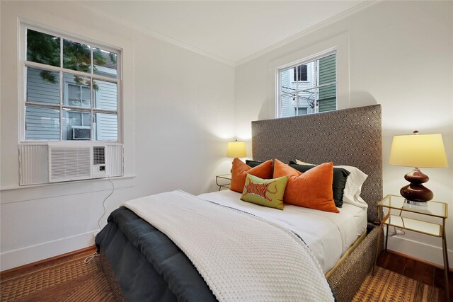 1305 Postoffice, Galveston, TX 77550 - bedroom featuring wood finished floors, baseboards, and ornamental molding