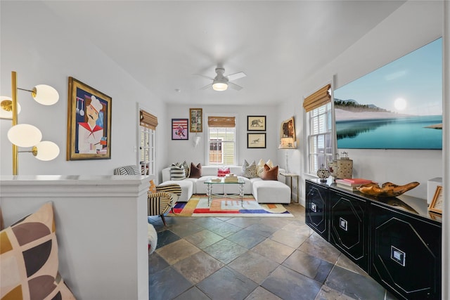 1305 Postoffice, Galveston, TX 77550 - living area featuring stone tile floors and a ceiling fan